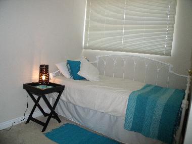 Standard Single carpeted bedroom with large single bed