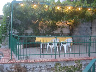 Standing on the sunny terrace, andlooking to the other one