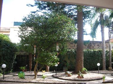 the garden adorned with pinkish pebbles and lava stones