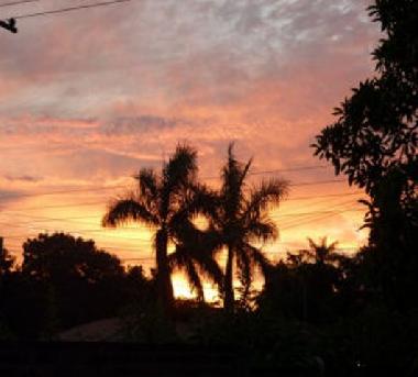 The setting sun with Palm View
