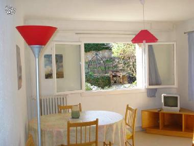 Living room with couch opening as a bed