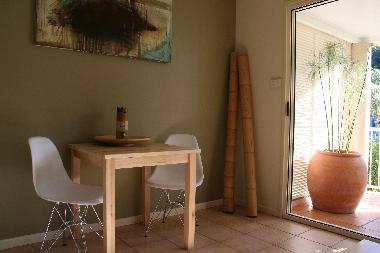 breakfast area leading on to balcony with larger table and seats