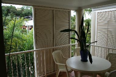 balcony with shutters and eating area