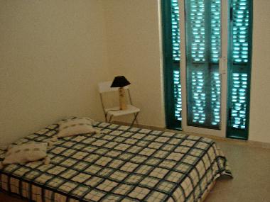 Bedroom with a small balcony