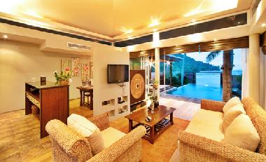 living room, with view towards the swimming pool and bay