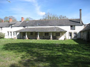 other side of the house (parking area) ("front side")