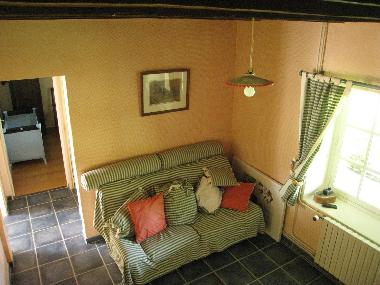 middle room ground floor. TV and bed. Leading to rooms 3 and 4