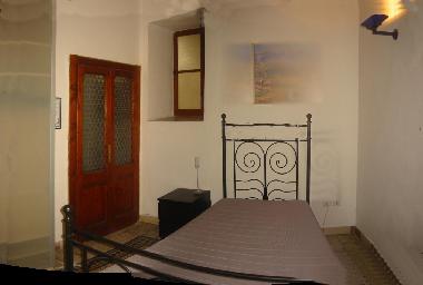 A slightly smaller bedroom, also with a spacious wardrobe