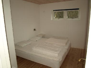 One of the four Bedrooms with high quality beds