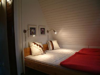 The double bedroom that overlooks the rear garden.