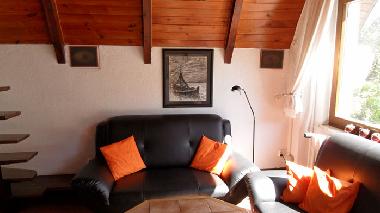 The living/dining room with 2X2 seater sofas.