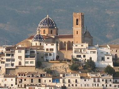 The historical blue church surrounden by the old town.