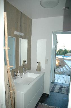 Bathroom with 3 sinks , shower, and toilet