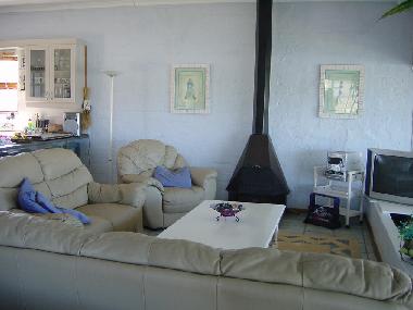 The lounge with kitchen on left and BBQ room on right.