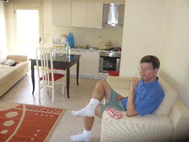 Leaving room with a kitchen