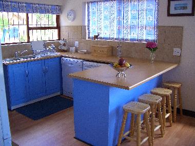 The fully equipped open-plan kitchen