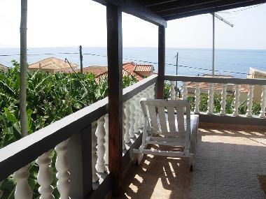 Sunny House East top third floor balcony with ocean and banana field views