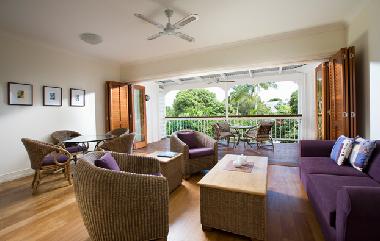large living area with kitchen/laundry to left
