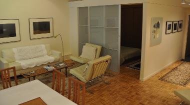 view of rear living room and queen bedroom