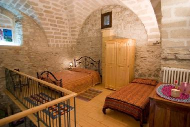 The sleeping area of the studio apartment