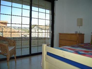 2nd bedroom has a trundle bed, room sleeps 2 guests.  The washing machine is located on this balcony