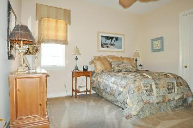 guest bedroom with queen size bed