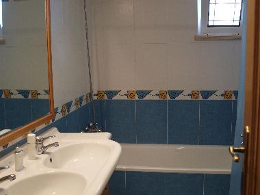 One of the two bathrooms, all with bath, WC and bidet.  Towels are also provided.