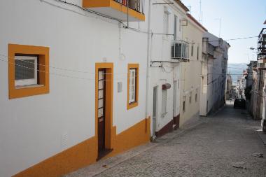 Outside, with the sea down the street