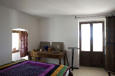 Bedroom overlooking the balcony