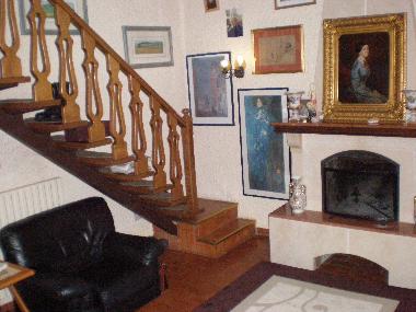 The living room and the stairs to the first flour