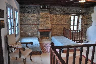 Main room in upper floor, 2 beds