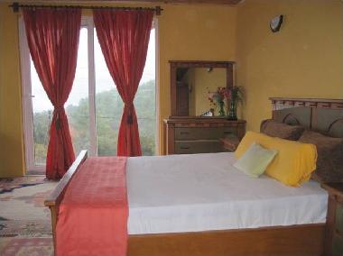 Master bedroom - upstairs with queen size bed and views