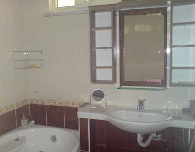 Master bedroom upstairs ensuite with jacuzzi, bath, shower, toilet