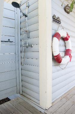 Sea cabin's outdoor shower with hot and cold water