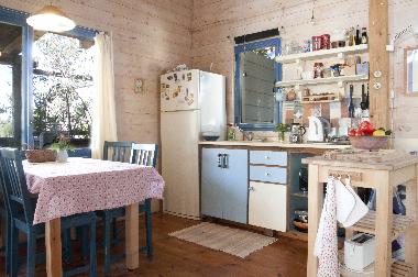 Sea cabin's kitchen with dining area