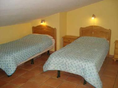 the semi-separated area with 2 single beds