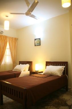 Airconditioned bedroom with twin beds and branded 8 inches mattress