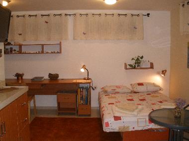 main sleeping room with tv  ,dvd  a/c  ,kitchinette,  free  internet  desk &cupbord.