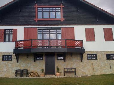 The front of the chalet with balcony