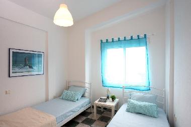 Douible bedroom with two single beds