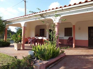 the large covered terrace of the guest house