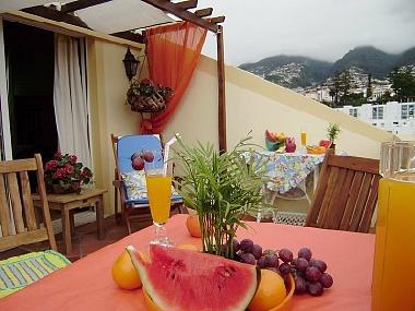 Breakfast with fruits and juices at the balcony