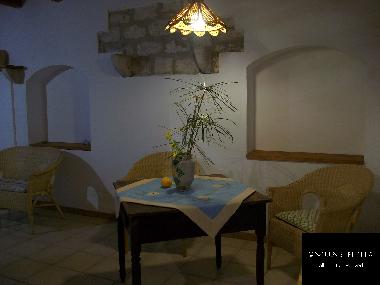 A foreshortening of the living room of the Arancio apartment.