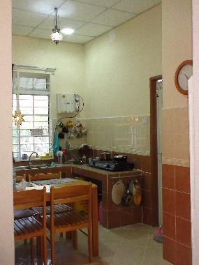 kitchen with 6chairs dining table, stove, water filter, fridge