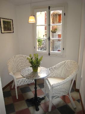 The master bedroom displays original unglazed terracotta tiles in three-colour harlequin pattern