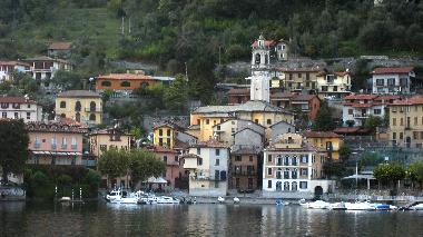 Sala as seen from Isola Comacina the bell tower of St Bartholomeo rises above the village