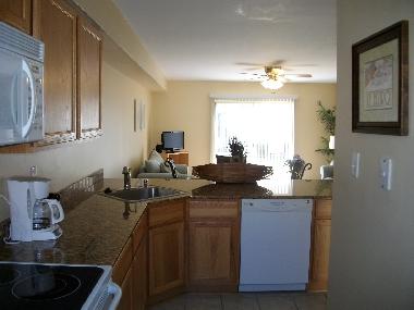 kitchen with granite countertops and dishwasher
