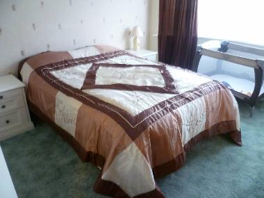 Main bedroom and travelcot