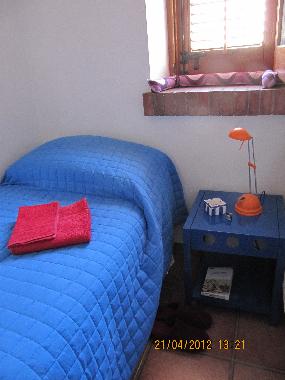 single bedroom with window mountain view
