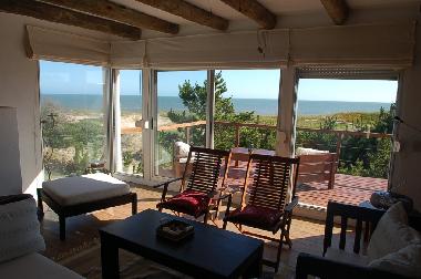 Upper living room with deck facing sea & terrace facing garden